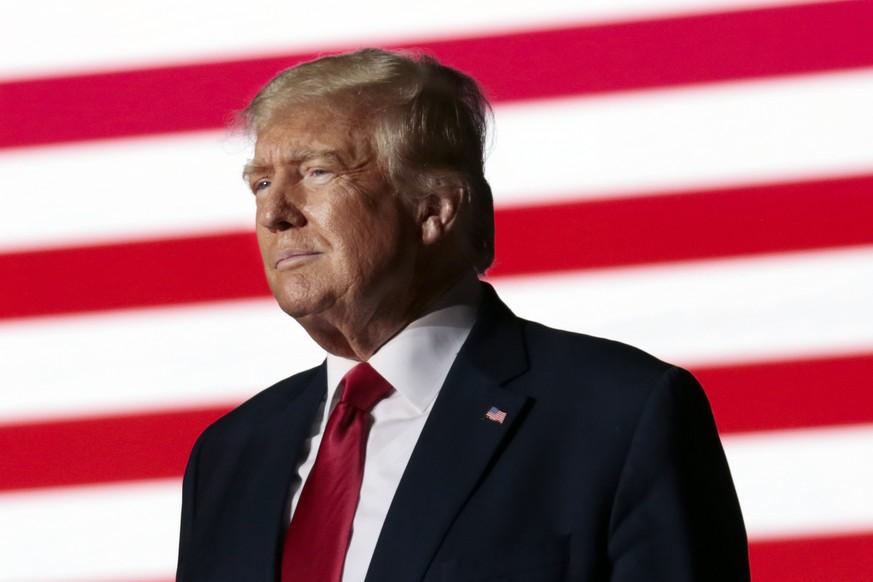 FILE - Former President Donald Trump listens to applause from the crowd as he steps up to the podium at a rally Friday, Sept. 23, 2022, in Wilmington, N.C. Lawyers for former President Donald Trump as ...