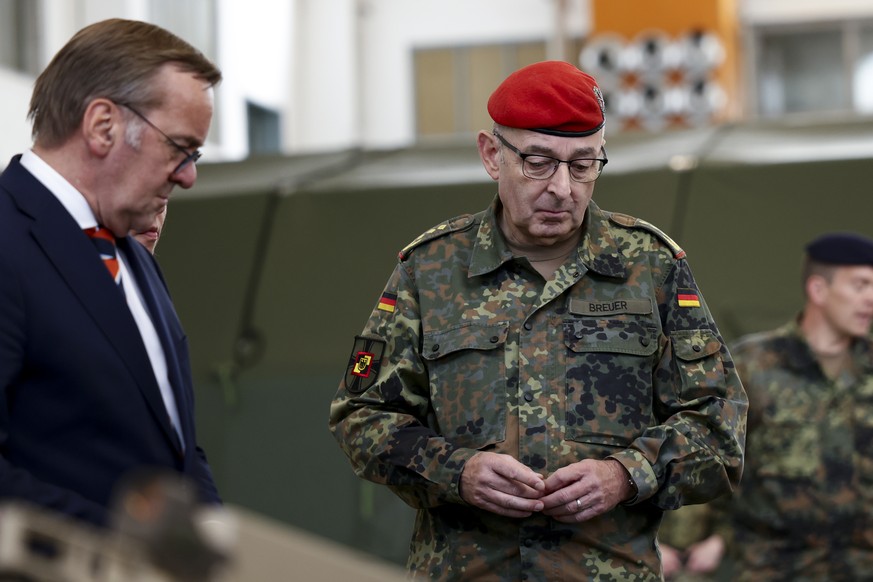 epa13041606 German Defense Minister Boris Pistorius (L) and Inspector General of the Bundeswehr, General Carsten Breuer (R) during a visit to the Air Force Force Protection Regiment at Upjever Air Bas ...