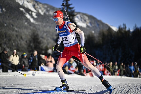 Sebastian Stalder of Switzerland competes during the men&#039;s 12.5 km pursuit race at the IBU Biathlon World Cup, on Saturday, December 16, 2023, in Lenzerheide, Switzerland. (KEYSTONE/Gian Ehrenzel ...