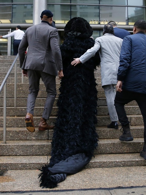 Cardi B arrives at Queens County Criminal Court in New York City on Tuesday, December 10, 2019. The 26-year-old is accused of throwing bottles and chairs at two bartenders at Angels Strip Club in Flus ...