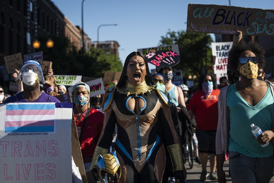 Chicago drag performer Miss Toto, center, joins several black drag queens to lead the &quot;Drag March for Change&quot; in the Boystown neighborhood on the North Side of Chicago, Sunday afternoon, Jun ...