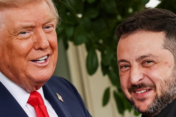 U.S. President Donald Trump greets Ukrainian President Volodymyr Zelenskiy at the White House, amid negotiations to end the Russian war in Ukraine, in Washington, D.C., U.S., August 18, 2025. REUTERS/ ...