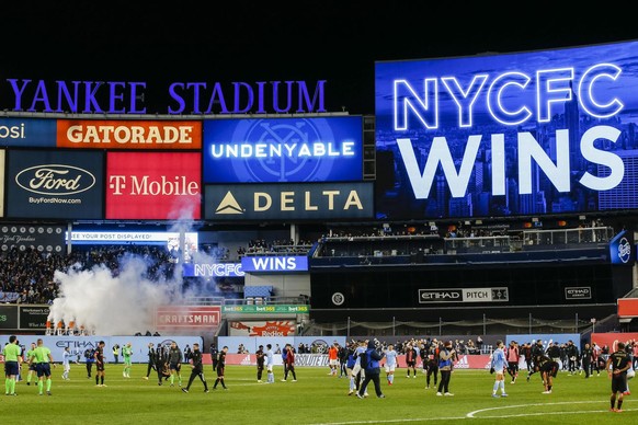 Players for New York City FC and Atlanta United exit 5he field at the end of an MLS soccer match at Yankee Stadium, Sunday, Nov. 21, 2021, in New York. (AP Photo/Eduardo Munoz Alvarez)