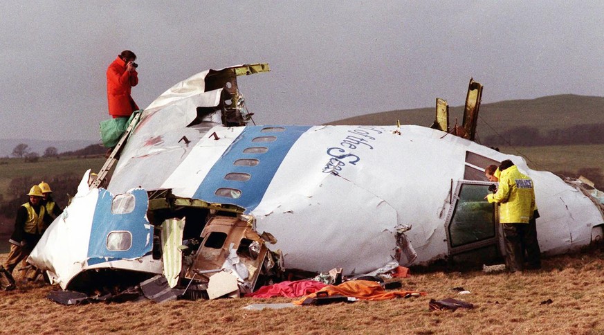 FILE - This Dec. 22, 1988 file photo shows Police and investigators look at what remains of the flight deck of Pan Am 103 on a field in Lockerbie, Scotland. Libyan Abdel Baset al-Megrahi the only man  ...