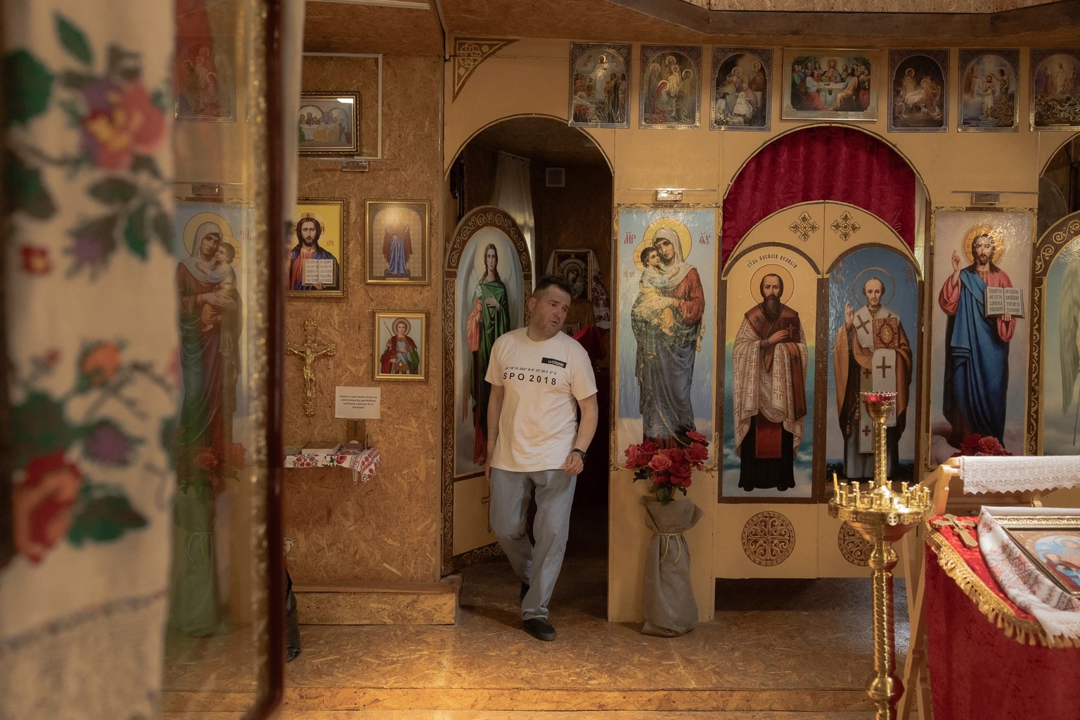 Archpriest Oleksandr Tkachuk, 53, walks after a prayer service at the Church of the Holy Martyrs Vira, Nadiya, Lyubov, and Mother Sophia of the Orthodox Church of Ukraine, which is aligned with Kyiv,  ...