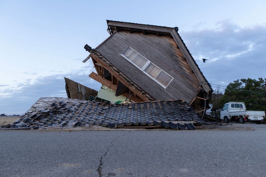 NANAO, JAPAN - JANUARY 02: A house damaged by an earthquake is seen on January 02, 2024 in Nanao, Japan. The Noto Peninsula of Ishikawa Prefecture was struck by a 7.5 magnitude earthquake on New Years ...