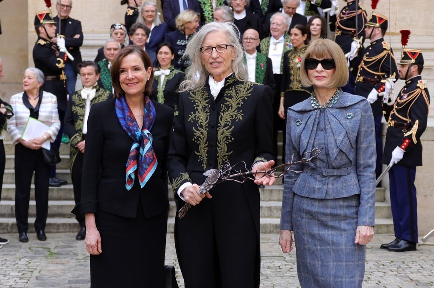 PARIS, FRANCE - MARCH 20: US Ambassador to France Denise Bauer, Annie Leibovitz and Anna Wintour pose during the intake ceremony of Annie Leibovitz into the Académie des Beaux-Arts on March 20, 2024 i ...