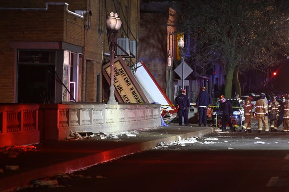 Authorities work the scene at the Apollo Theatre after a severe spring storm caused damage and injuries during a concert, late Friday, March 31, 2023, in Belvidere, Ill. (AP Photo/Matt Marton)