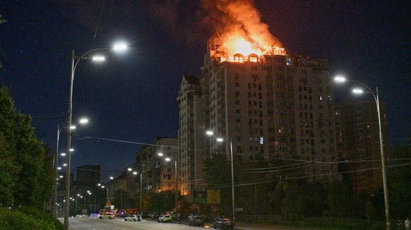 An apartment building burns after a Russian missile attack in Kyiv, Ukraine, Thursday, July 2, 2026. (AP Photo/Danylo Antoniuk)