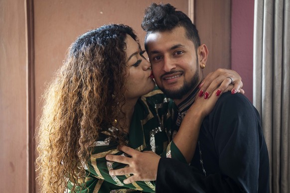 FILE- Same-sex couple Surendra Pandey, right, and Maya Gurung, who got married six years ago, pose for a photograph during an interview with the Associated Press in Kathmandu, Nepal, Thursday, June 29 ...