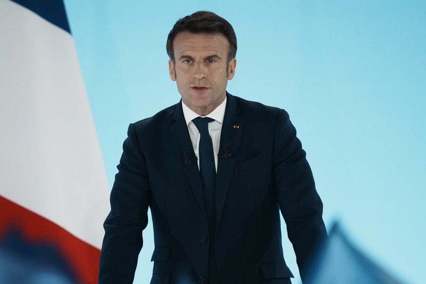 Current French President and centrist presidential candidate for reelection Emmanuel Macron speaks at his election night headquarters Sunday, April 10, 2022 in Paris. French polling agencies projected ...