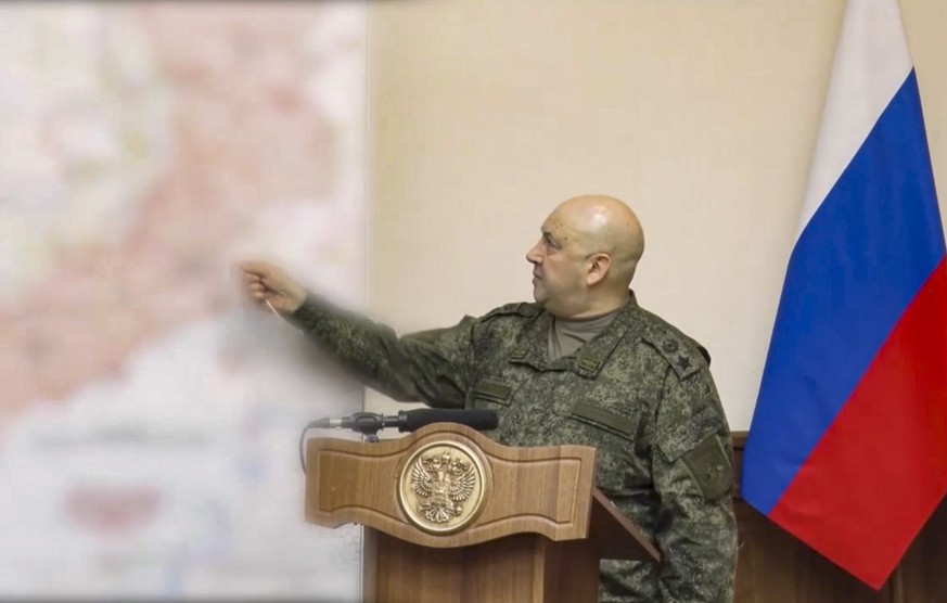 epa10296349 A handout still image taken from a handout video provided by the Russian Defence ministry press-service shows General of the Army Sergei Surovikin, commander of the joint group of troops i ...