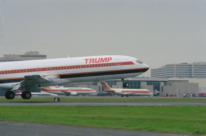 (Original Caption) Washington: A plane carrying real estate mogul Donald Trump lands at National Airport outside Washington to celebrate the inaugural voyages of the Trump Shuttle.