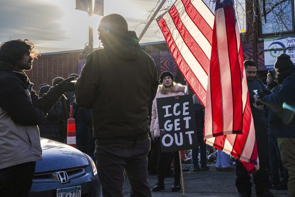 People visit a makeshift memorial for 37-year-old Alex Pretti, who was fatally shot by a U.S. Border Patrol officer last week, on Saturday, Jan. 31, 2026, in Minneapolis. (AP Photo/Ryan Murphy)
Immigr ...