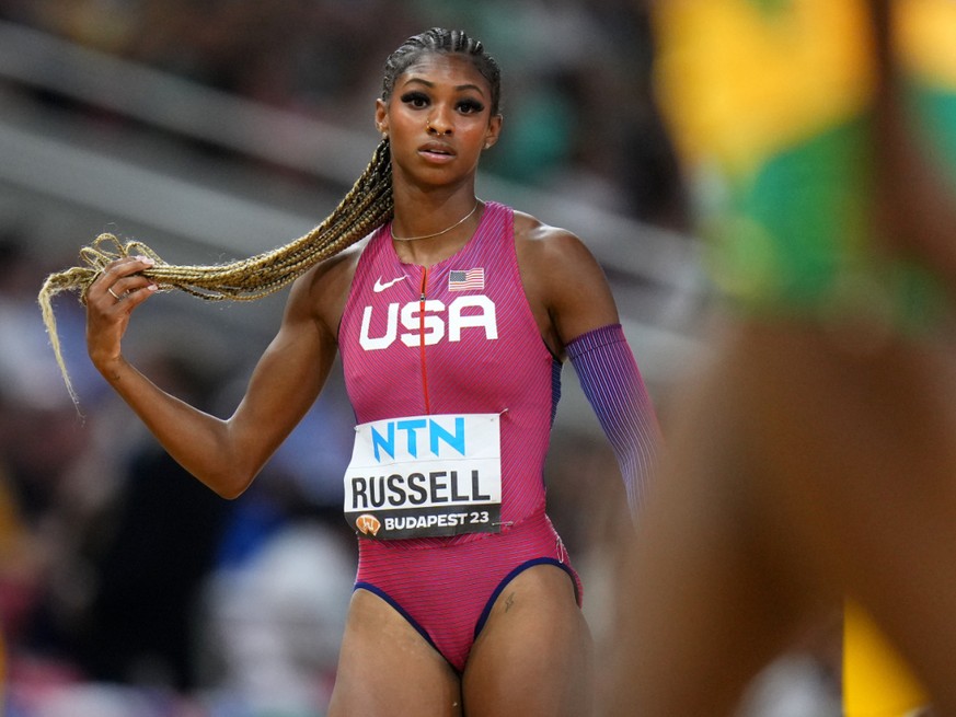 Masai Russell a sign