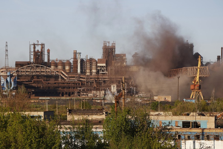 FILE - Smoke rises from the Metallurgical Combine Azovstal in Mariupol during shelling, in Mariupol, in territory under the government of the Donetsk People&#039;s Republic, eastern Ukraine, Saturday, ...