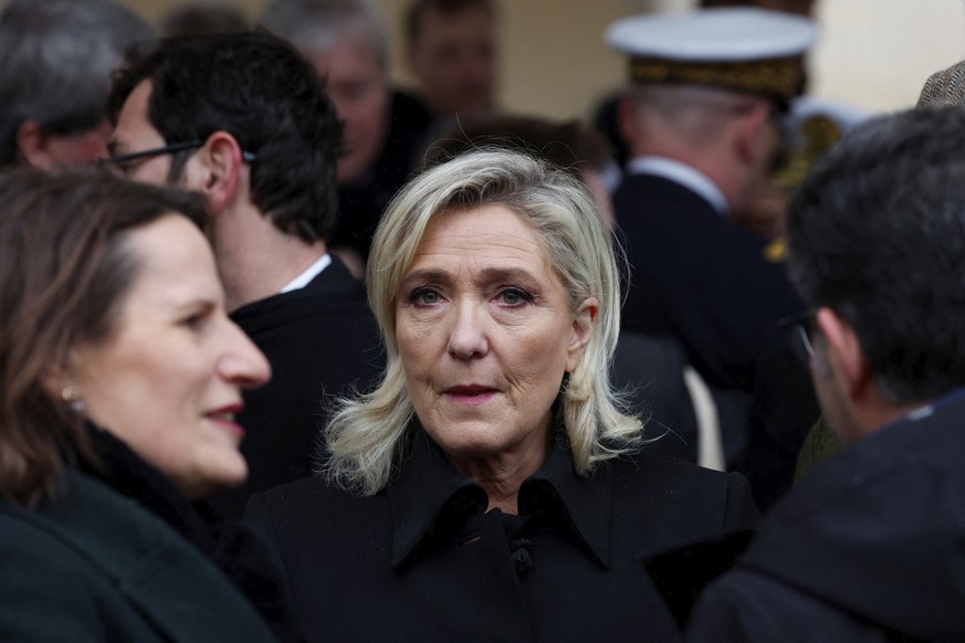 Marine Le Pen, leader of the French far-right National Rally party arrives to attend a ceremony for the French victims of the Oct.7 2023 Hamas&#039; attack, at the Invalides monument, Wednesday, Feb.7 ...