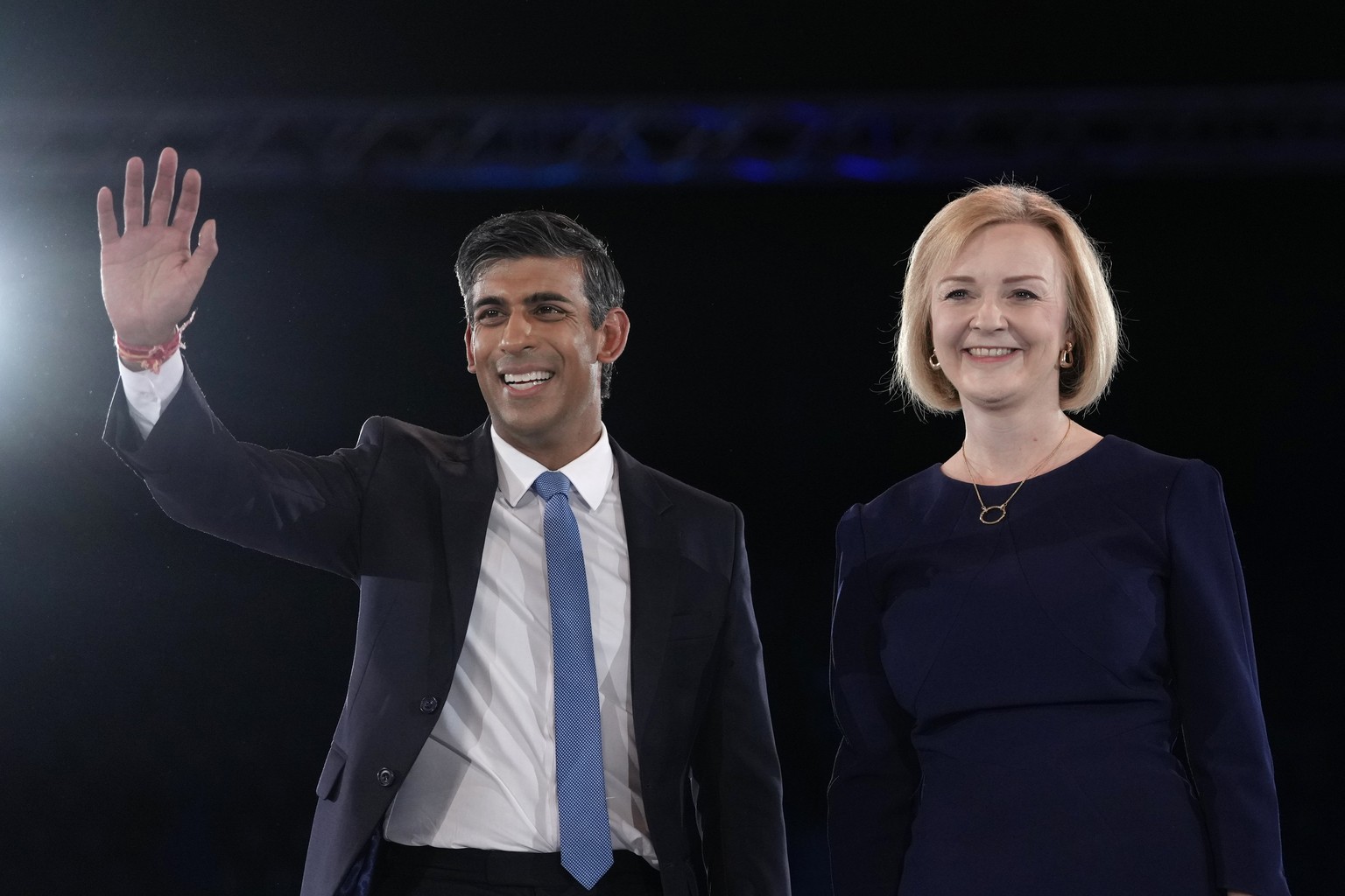 FILE - Liz Truss, right, and Rishi Sunak on stage after a Conservative leadership election hustings at Wembley Arena in London, Wednesday, Aug. 31, 2022. After weeks of waiting, Britain will finally l ...