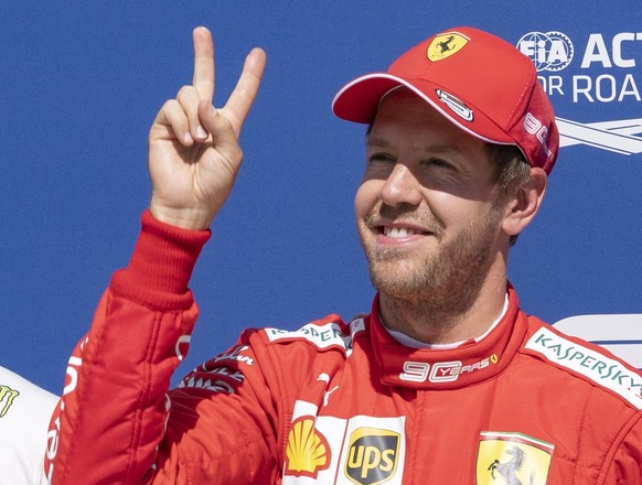 Ferrari driver Sebastian Vettel of Germany celebrates his second consecutive pole following qualifying for the Formula One Canadian Grand Prix auto race in Montreal, Saturday, June 8, 2019. (Paul Chia ...