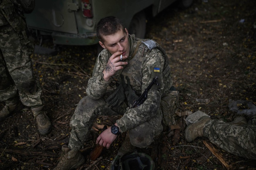 (FILES) Infantry recruit Mykola Lebedev, 18, of the 28th Seperate Mechanized Brigade smokes during a break as he undergoes a basic training course at an undislosed location in eastern Ukraine on Octob ...