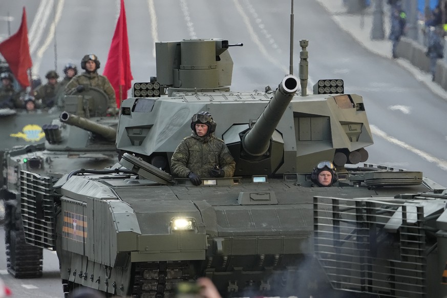 A Russian T-14 Armata tank rolls along Tverskaya street toward Red Square to attend a rehearsal for the Victory Day military parade in Moscow, Russia, Wednesday, May 4, 2022. The parade will take plac ...