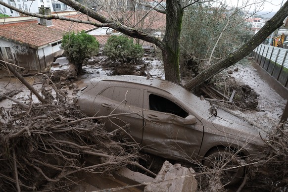 epa12706084 A damaged car caused by water, mud, and rocks from the Serra de Sao Mamede mountains during severe weather in Portalegre, Portugal, 05 February 2026. At least eleven people have died in Po ...