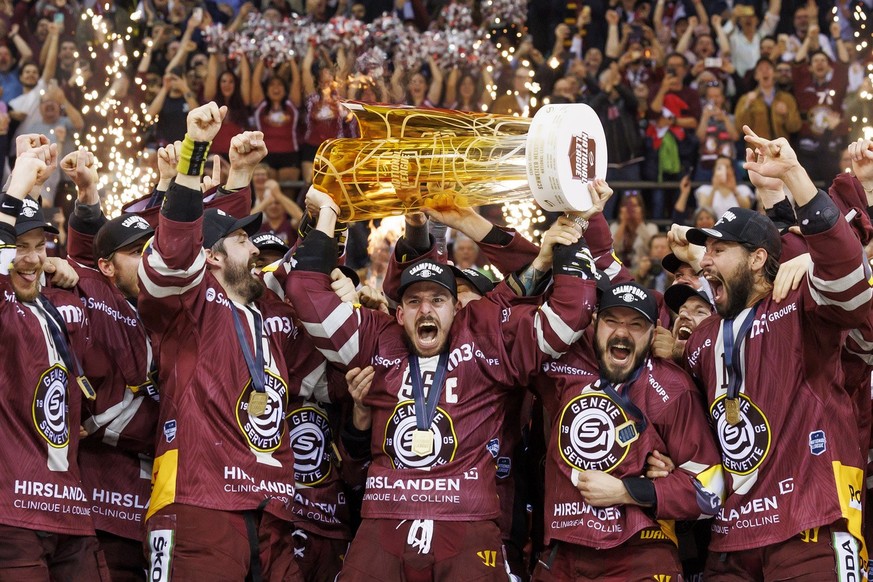 Geneve-Servette&#039;s forward Noah Rod lift the trophy after winning the seventh and final leg of the ice hockey National League Swiss Championship final playoff game between Geneve-Servette HC and E ...