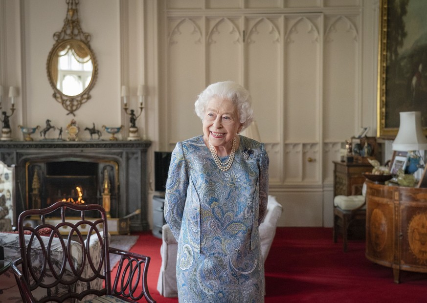 Britain&#039;s Queen Elizabeth II smiles while receiving the President of Switzerland Ignazio Cassis and his wife Paola Cassis during an audience at Windsor Castle in Windsor, England, Thursday, April ...