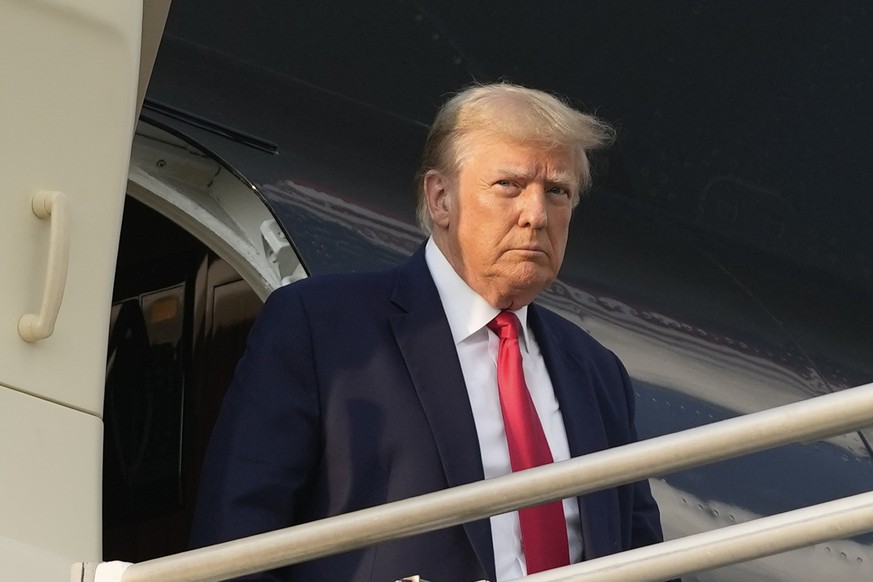 Former President Donald Trump steps off his plane as he arrives at Hartsfield-Jackson Atlanta International Airport, Thursday, Aug. 24, 2023, in Atlanta. (AP Photo/Alex Brandon)
Donald Trump