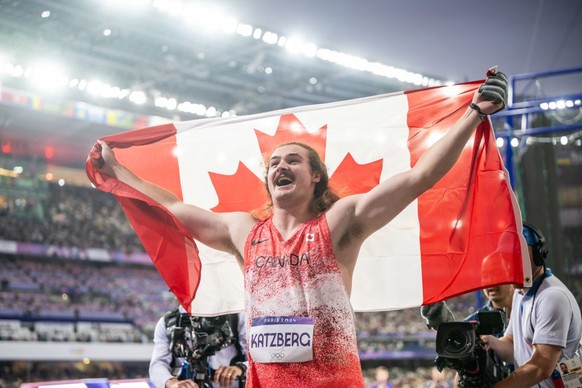 PARIS, FRANCE - AUGUST 4: Gold medalist Ethan Katzberg of Team Canada celebrates after winning the Men&#039;s Hammer throw Final on day nine of the Olympic Games Paris 2024 at Stade de France on Augus ...