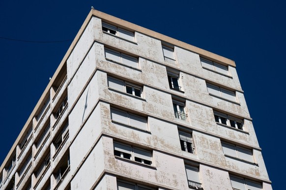 This photo taken on May 20, 2026 shows a block of flats in the Pontcarral projects where a mother threw herself out of a 13th-floor window with three of her young children in Toulon, southern France.  ...