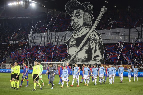 Teams and match officials walk onto the pitch before the UEFA Europa Conference League play-off second leg soccer match between Switzerland&#039;s FC Basel 1893 and Turkey&#039;s Trabzonspor at the St ...