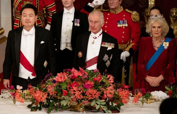 South Korean President state visit to the UK President of South Korea Yoon Suk Yeol listens as King Charles III speaks at the state banquet at Buckingham Palace, London, for the state visit to the UK  ...