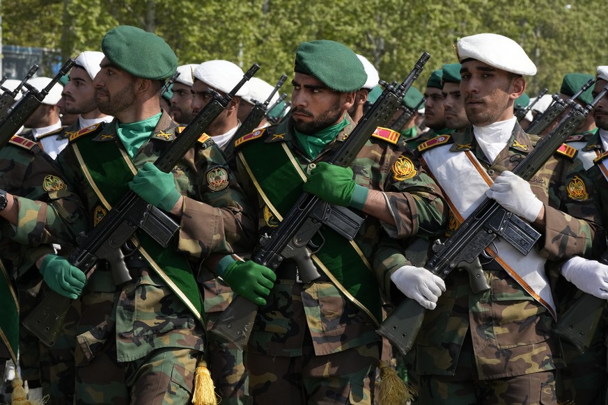 Iranian army members march during Army Day parade at a military base in northern Tehran, Iran, Wednesday, April 17, 2024. In the parade Iran&#039;s President Ebrahim Raisi warned that the &quot;tinies ...