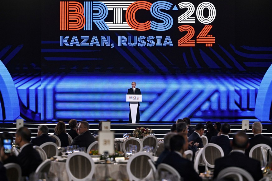 Russian President Vladimir Putin speaks at festive reception of the BRICS Summit in Kazan, Russia, Wednesday, Oct. 23, 2024. (Alexander Nemenov, Pool Photo via AP)