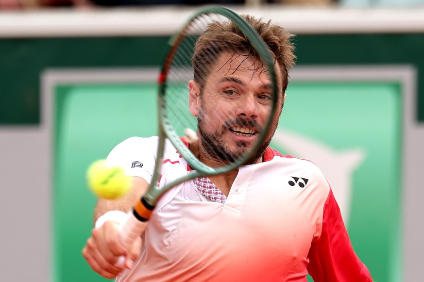 epa12136987 Stan Wawrinka of Switzerland plays a backhand during his Men's 1st round match against Jacob Fearnley of Great Britain at the French Open Grand Slam tennis tournament at Roland Garros ...