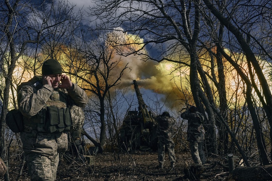 FILE - Ukrainian soldiers fire a self-propelled howitzer towards Russian positions near Bakhmut, Donetsk region, Ukraine, Sunday, March 5, 2023. Europe?s biggest armed conflict since World War II is p ...
