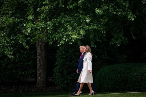 WASHINGTON, DC - MAY 25: U.S. President Donald Trump and first lady Melania Trump depart the White House for Baltimore, Maryland on May 25, 2020 in Washington, DC. The Trumps will attend a Memorial Da ...
