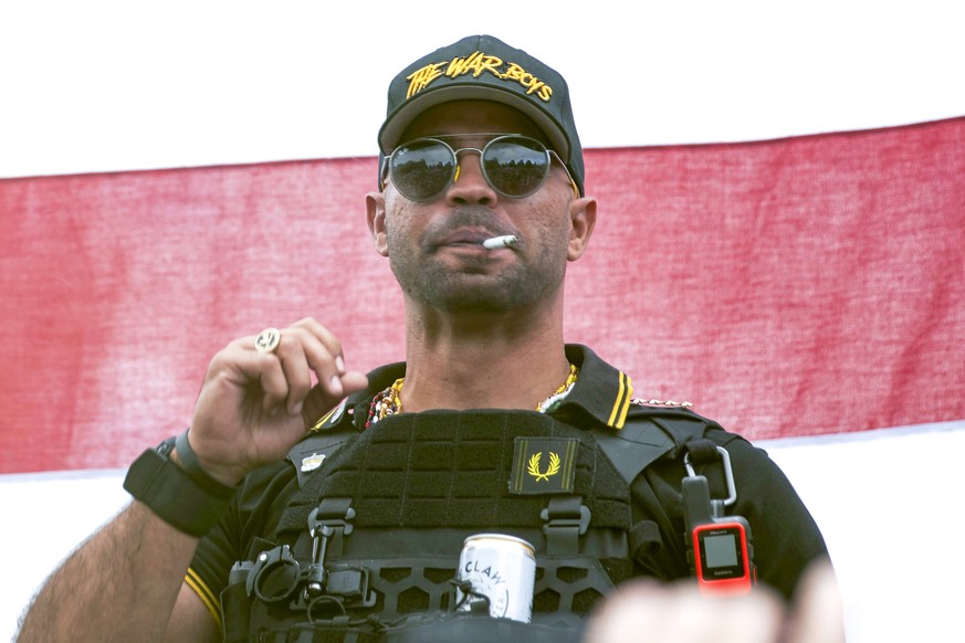 FILE - Proud Boys leader Henry &quot;Enrique&quot; Tarrio wears a hat that says The War Boys during a rally in Portland, Ore., Sept. 26, 2020. Tarrio and three other members of the far-right extremist ...