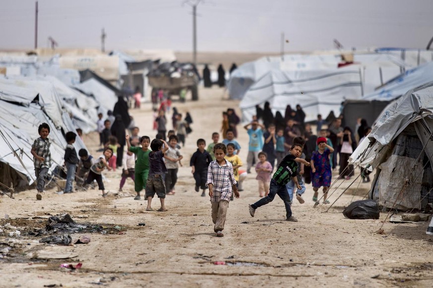 Children gather outside their tents, at al-Hol camp, which houses families of members of the Islamic State group, in Hasakeh province, Syria, Saturday, May 1, 2021. It has been more than two years tha ...