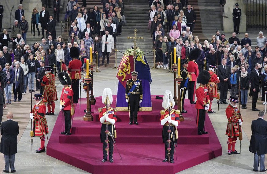 Members of the public file past as King Charles III, the Princess Royal, the Duke of York and the Earl of Wessex hold a vigil beside the coffin of their mother, Queen Elizabeth II, as it lies in state ...