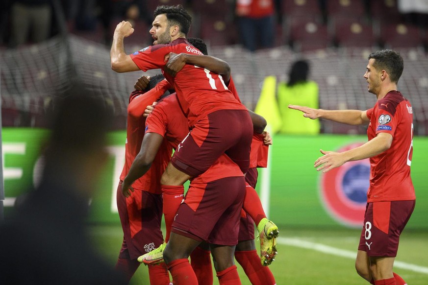 Switzerland&#039;s midfielder Renato Steffen, left, and Switzerland&#039;s midfielder Remo Freuler, right, celebrate the second goal during the 2022 FIFA World Cup European Qualifying Group C football ...