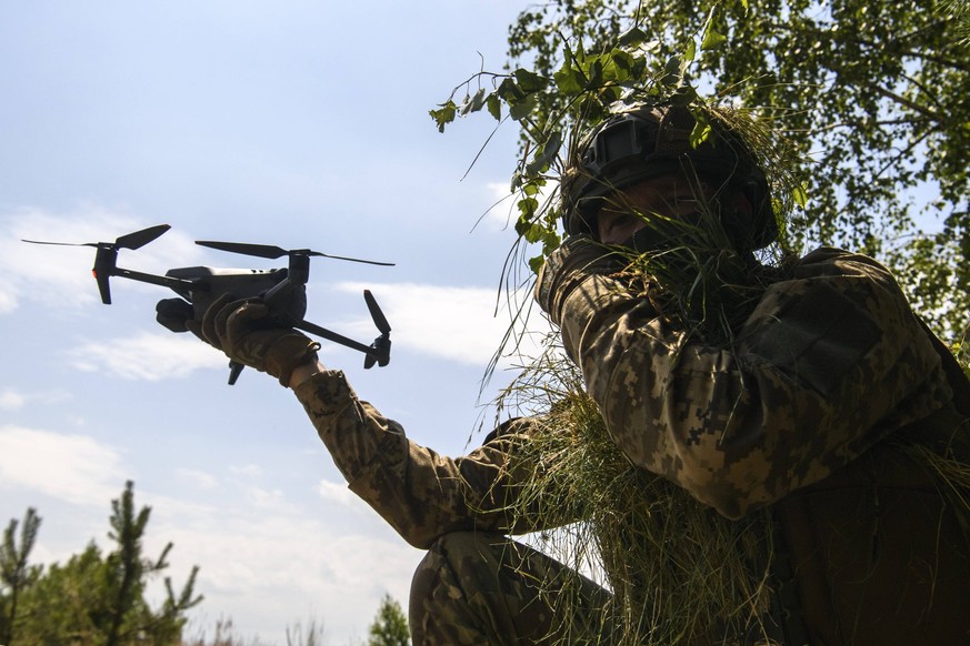 Ukrainian Soldiers Of The 61st Separate Mechanized Brigade During Military Exercises In The Chernihiv Region Ukrainian soldier of the 61st Separate Mechanized Brigade masters aerial reconnaissance usi ...
