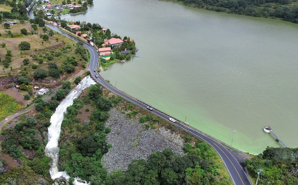epa12446172 Aerial photograph showing the Estanzuela dam, which is at maximum capacity, in El Chico, Mexico,10 October 2025. At least 23 people died and eight are missing after heavy rains hit Mexico  ...