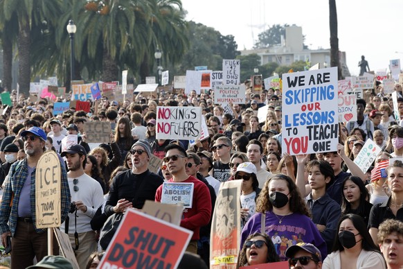 epa12693674 Anti-ICE protestors rally during a nationwide general strike demonstration at Mission Dolores Park in San Francisco, California, USA, 30 January 2026. The nationwide general strike, called ...