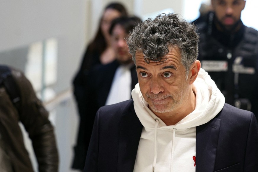 (FILES) French TV host and real estate agent Stephane Plaza, accused of acts of violence against two former companions, arrives for the verdict of his trial at the Paris Criminal Court in Paris, on Fe ...