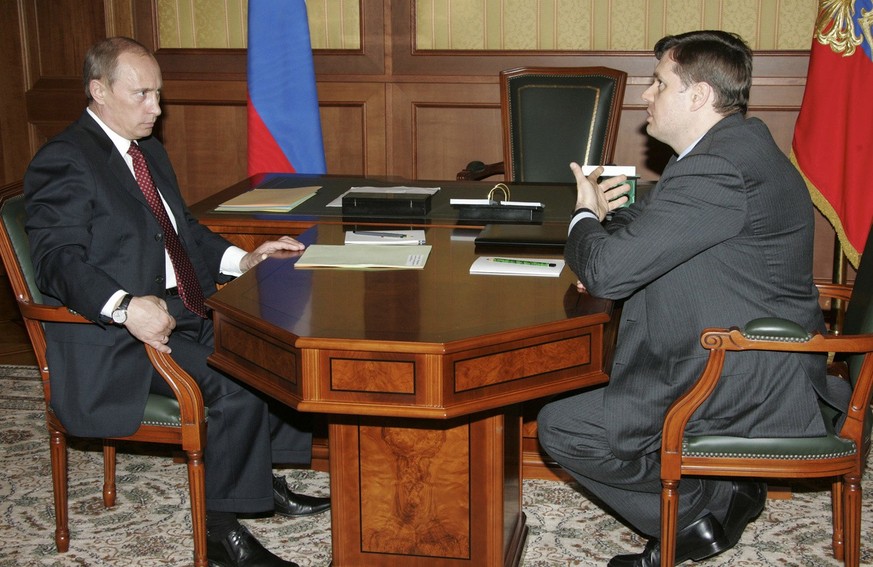 Russian President Vladimir Putin, left, and Alexei Mordashov, Head of the metals and mining conglomerate Severstal Group, seen during a meeting at the Bocharov Ruchei residence in the Black Sea resort ...