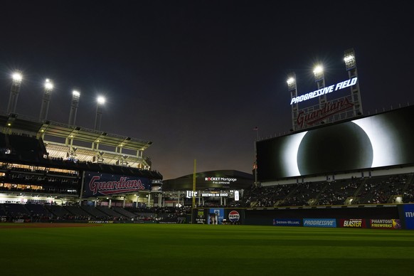 The large video screen over Progressive Field displays the total solar eclipse in Cleveland, Monday, April 8, 2024, before the Cleveland Guardians home opener baseball game against the Chicago White S ...