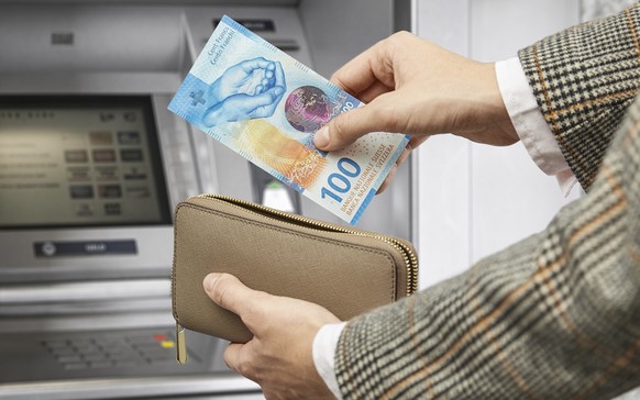 Bankomat-Szene 100-Franken-Note