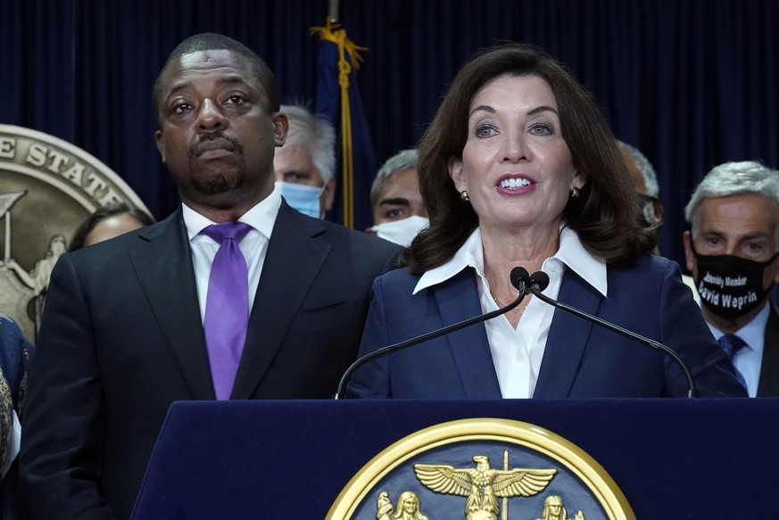 FILE �?? New York Gov. Kathy Hochul, accompanied by Lt. Gov. Brian Benjamin, left, speaks during ceremonies in the governor's office, in New York, Sept. 17, 2021. Benjamin, whose seven months in ...